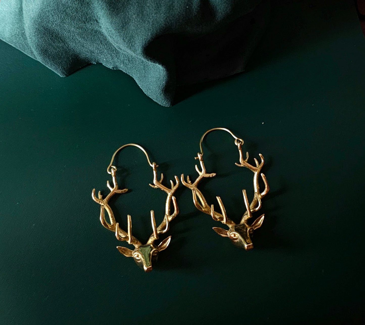 Handcrafted reindeer brass earring