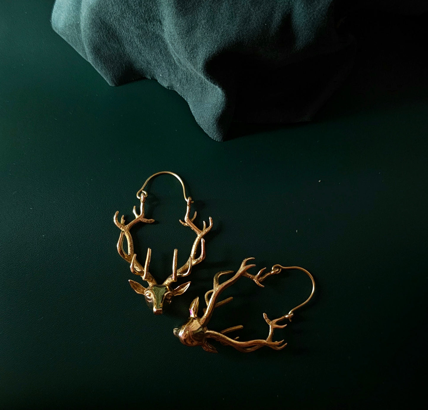 Handcrafted reindeer brass earring
