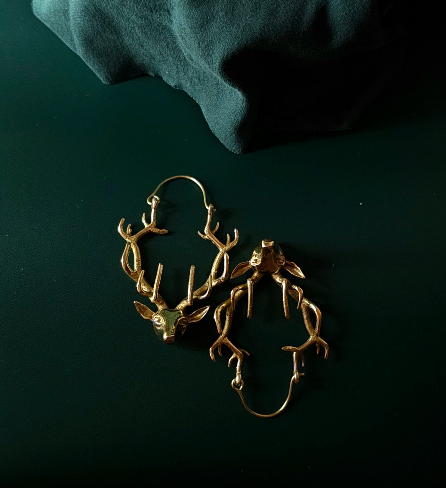 Handcrafted reindeer brass earring