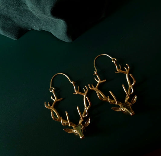Handcrafted reindeer brass earring